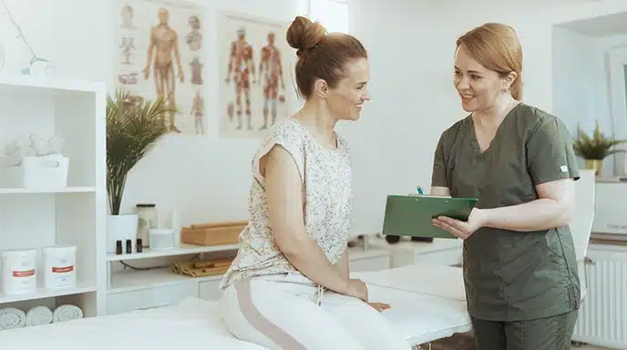 Two women discussing AGE Scanner results, highlighting biological aging and health insights
